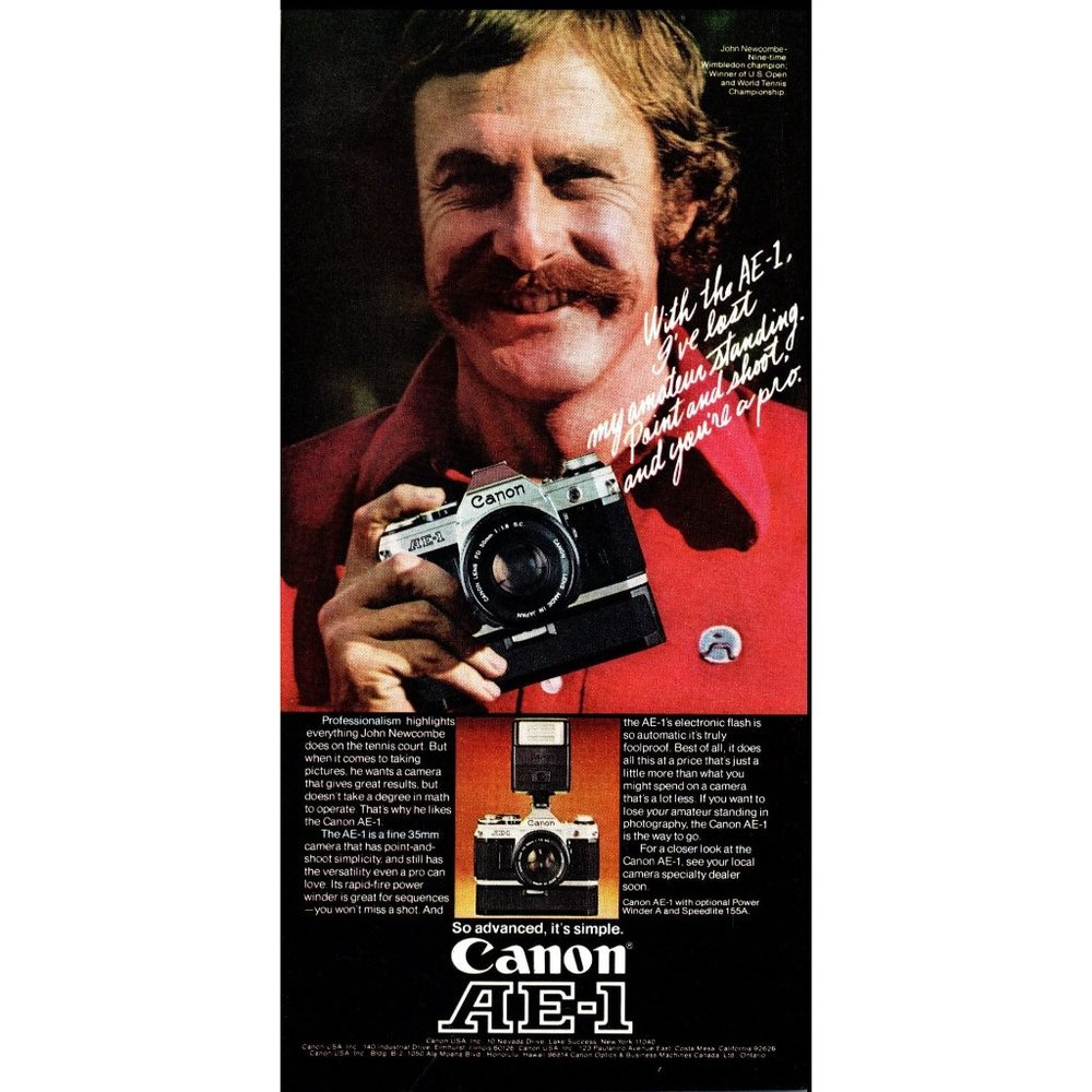 1976 Canon AE-1 SLR Film Camera Vintage Print Ad John Newcombe Tennis Wall Art
